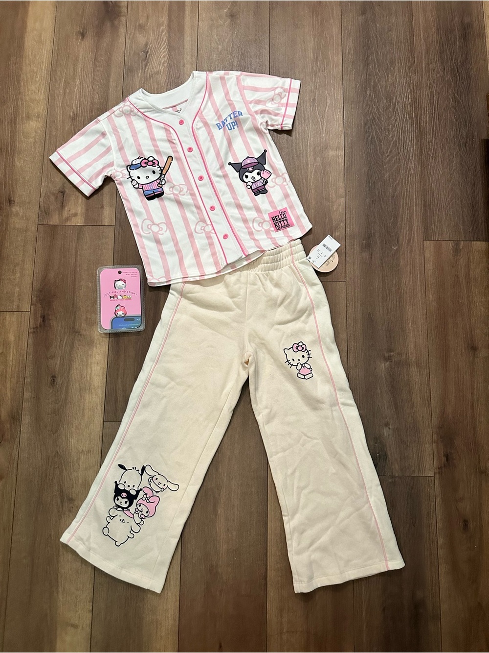 Hello Kitty jersey tshirt and sweatpants peel and stick charms included.